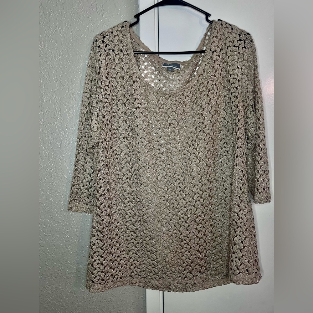 Woman’s beige sweater blouse.